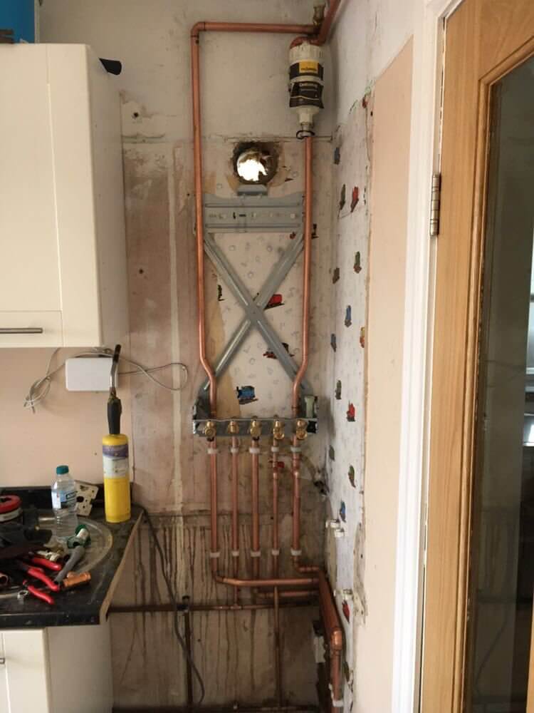 Copper pipework first fix with manifold and isolation valves during boiler installation